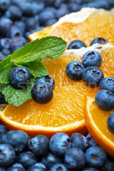 Freshly picked blueberries with orange Stock photo © Discovod