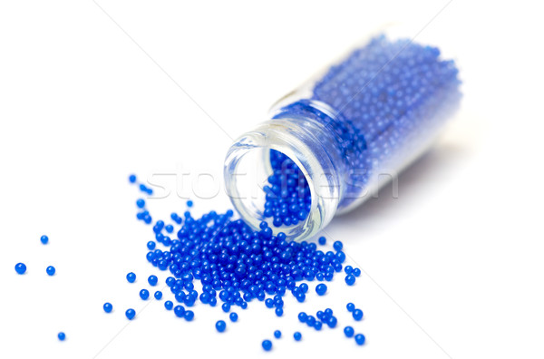 Small Glass Jar filled with Blue Balls of Bead Stock photo © Discovod