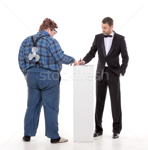 Elegant man arguing with a country yokel Stock photo © Discovod