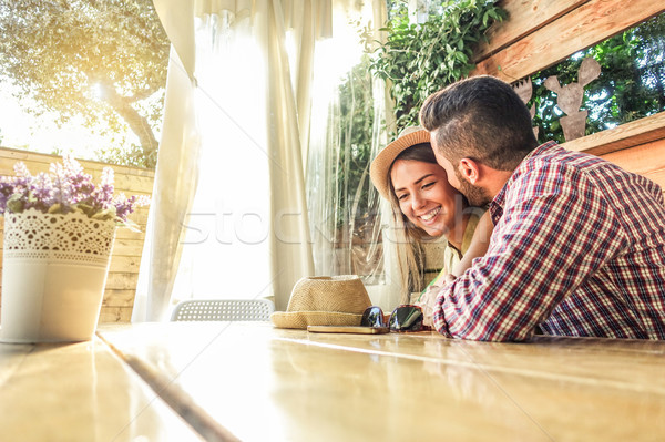 Young couple flirting at the first date at bar cafe table - Boyf Stock photo © DisobeyArt