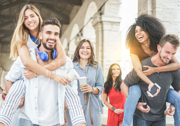 Young friends having fun in old city center - Happy students at  Stock photo © DisobeyArt