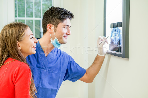 Young woman checking with dentist x-ray of their teeth - People  Stock photo © DisobeyArt