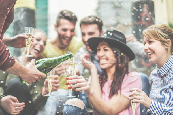 Heureux amis célébrer potable champagne Photo stock © DisobeyArt