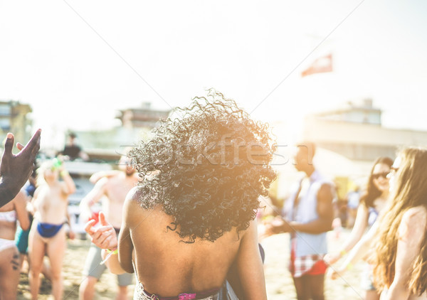 Young people dancing on beach party in summer time - Diverse cul Stock photo © DisobeyArt