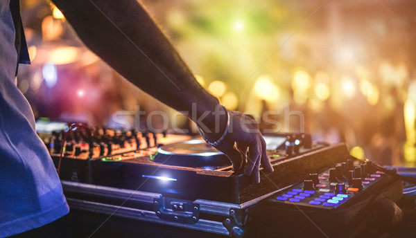 Dj mixing outdoor at beach party festival with crowd of people i Stock photo © DisobeyArt