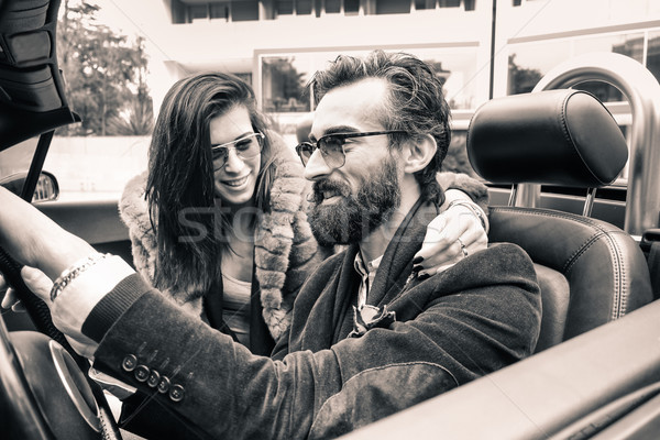 Hipster fashion couple ready for a road trip with a cabriolet ro Stock photo © DisobeyArt
