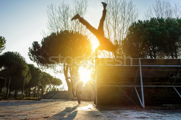 Friends performing freestyle biking and breakdancing at the same Stock photo © DisobeyArt