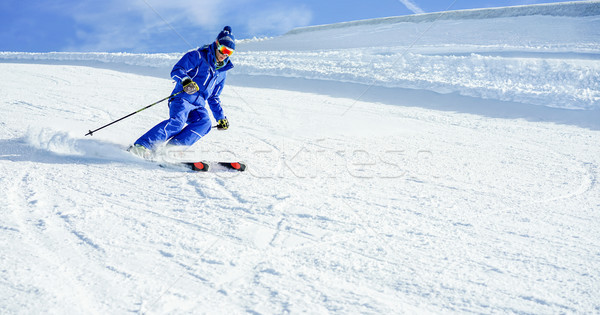 Young athlete skiing in Deux Alps french mountains on sunny day  Stock photo © DisobeyArt