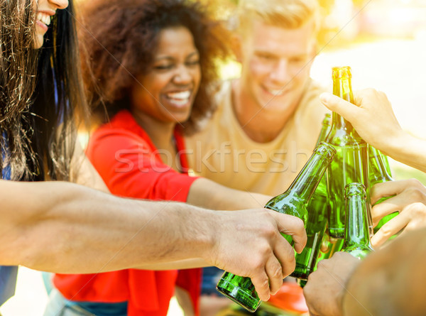 Happy diverse culture friends cheering with beer for summer barb Stock photo © DisobeyArt