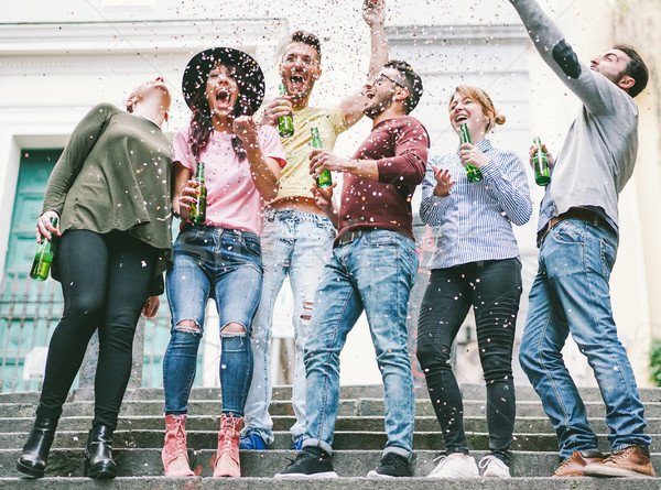 Stock photo: Happy crazy friends celebrating on the street drinking beer and 