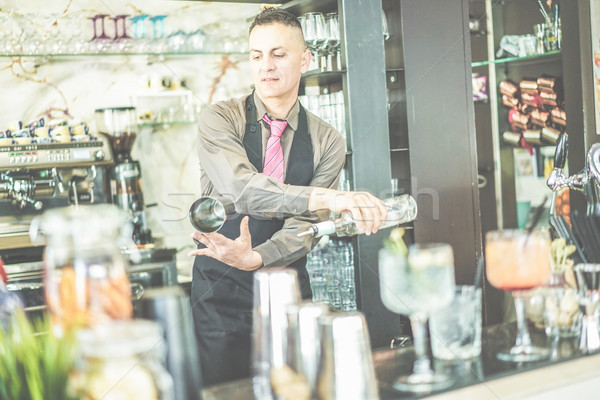 Bartender doing flair inside cruise american bar - Barman at wor Stock photo © DisobeyArt