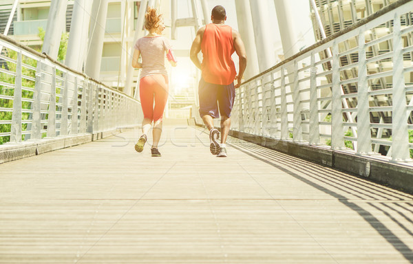 Two young athletes making jogging in a urban contest area outdoo Stock photo © DisobeyArt