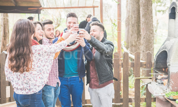 Happy friends cheering at barbecue dinner outdoor - Young people Stock photo © DisobeyArt