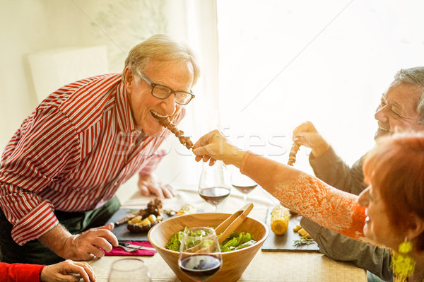 Boldog idős barátok barbecue ebéd otthon Stock fotó © DisobeyArt