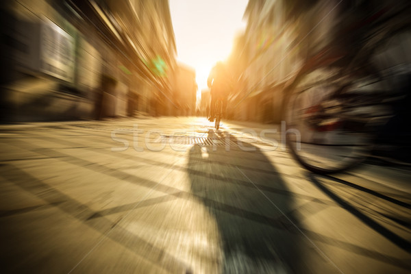 Citizen speeding with old style italian bicycle on city cente -  Stock photo © DisobeyArt