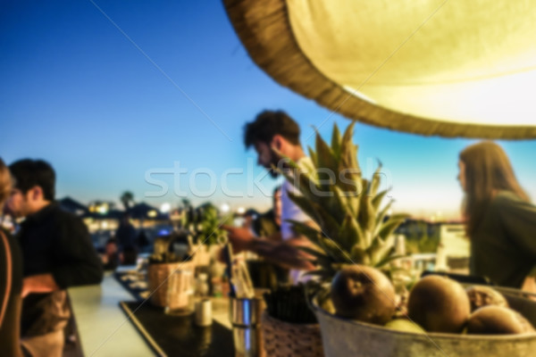 Blurred barman working in chiringuito bar at sunset beach party  Stock photo © DisobeyArt