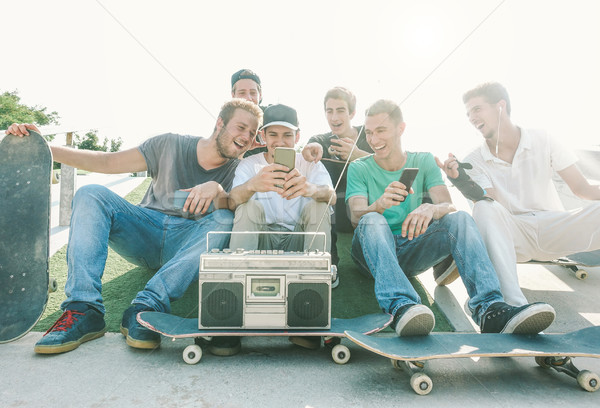 Young friends having fun at city skateboard park - Happy skaters Stock photo © DisobeyArt