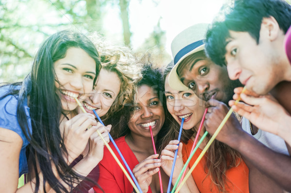 Group of multi race friends enjoying drink outdoor summer party  Stock photo © DisobeyArt