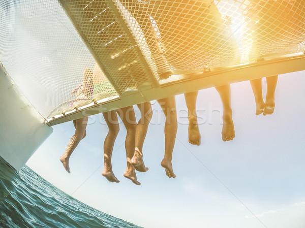 Groupe jeunes amis catamaran bateau [[stock_photo]] © DisobeyArt