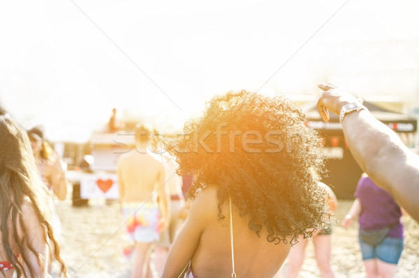 Young people dancing on beach party in summer time - Cheerful mu Stock photo © DisobeyArt
