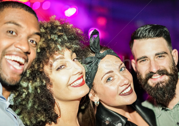 Happy friends taking selfie  in night club dance floor - Young p Stock photo © DisobeyArt