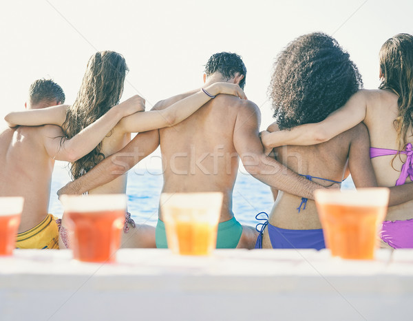 Arkadan görünüm genç arkadaşlar oturma tekne yaz tatili Stok fotoğraf © DisobeyArt