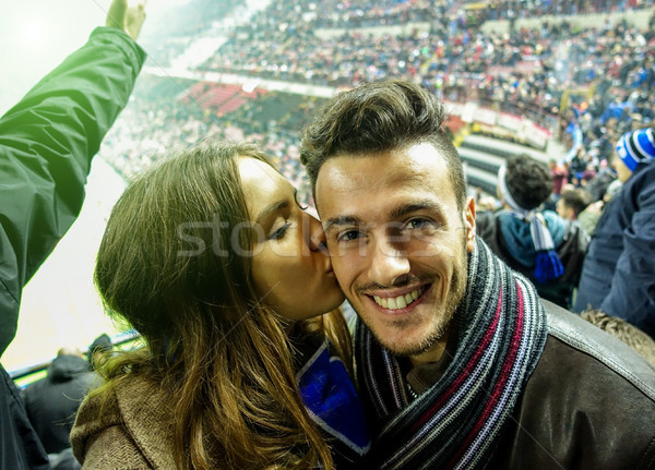 Selfie portrait of young couple watching sport soccer match in f Stock photo © DisobeyArt