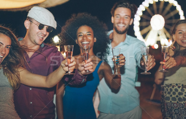 Happy crazy friends celebrating at beach 2018 new year's eve par Stock photo © DisobeyArt