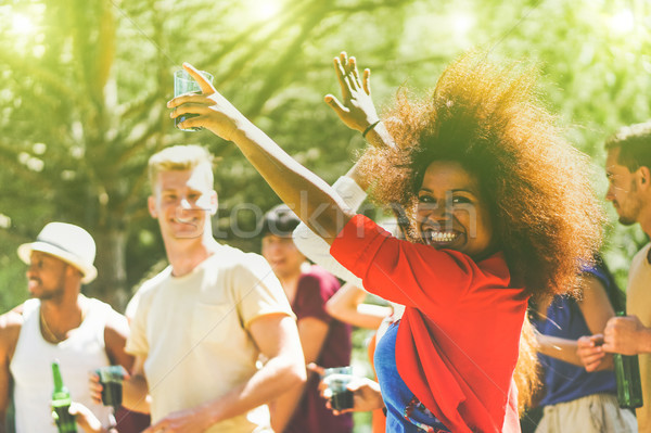 Multiracial young people dancing in forest party in summer time  Stock photo © DisobeyArt
