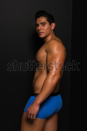Sportowiec młody człowiek niebieski czarny Zdjęcia stock © disorderly