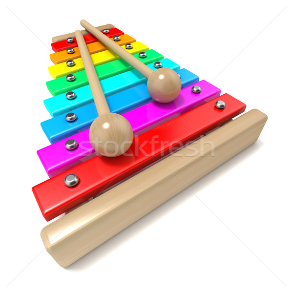 Xylophone with rainbow colored keys and with two wood drum stick Stock photo © djmilic
