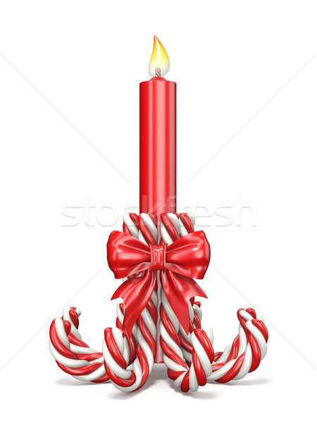 Christmas decoration made of candy canes, ribbon bow and candle  Stock photo © djmilic