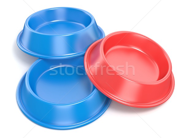 Two blue pet bowls for food and one red. 3D Stock photo © djmilic
