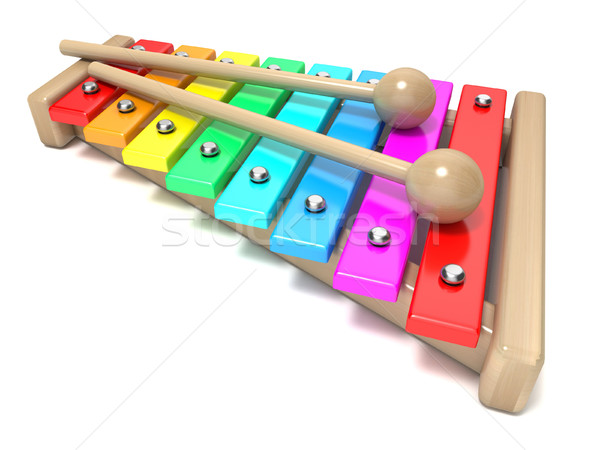 Stock photo: Xylophone with rainbow colored keys and with two wood drum stick
