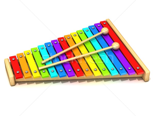 Xylophone with rainbow colored keys and with two wood drum stick Stock photo © djmilic