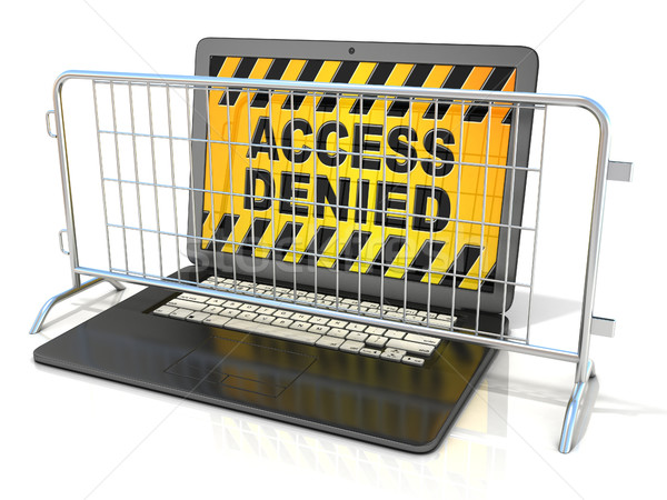 Black laptop with ACCESS DENIED sign on screen, and steel barric Stock photo © djmilic