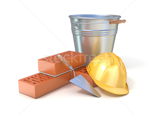 Fragment of red brick wall, trowel, metal bucket and safety helm Stock photo © djmilic