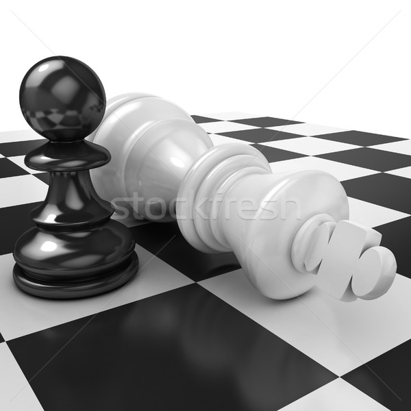 Stock photo: White pawn standing over fallen black king
