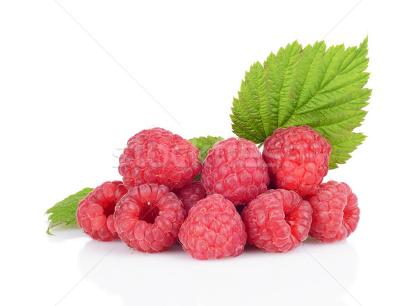 Few raspberries stacked in pile with leaves isolated white Stock photo © dla4