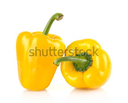 Studio shot of two yellow bell peppers isolated on white Stock photo © dla4