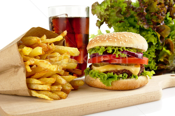 Cropped image of cheeseburger,french fries,glass of cola on wood Stock photo © dla4