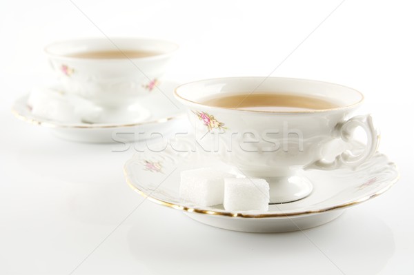 Old-style vintage two cups of tea on white background Stock photo © dla4
