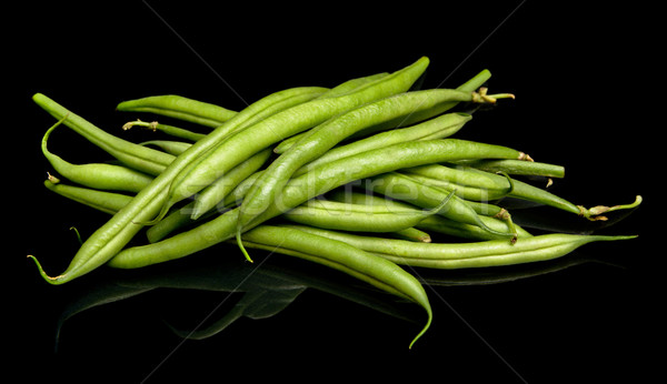 Group of green beans on black background Stock photo © dla4