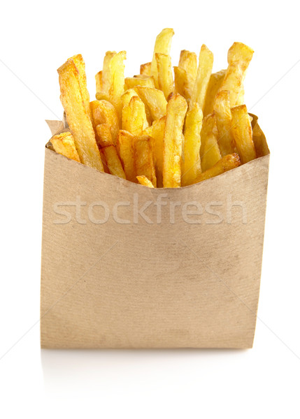 Stock photo: French fries in the paper bag isolated on white