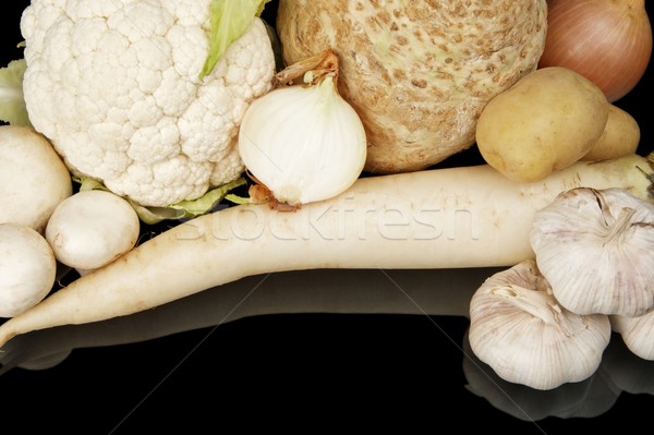 Collection of white vegetables on black top view Stock photo © dla4