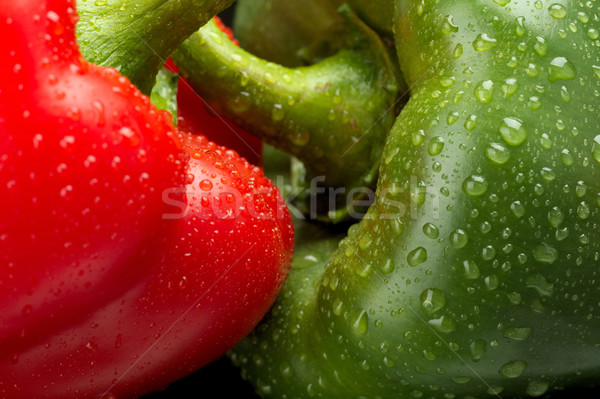 Cut shot of green,red bell pepper background with water drops Stock photo © dla4