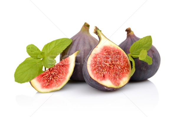 Four sliced figs isolated with mint on white background  Stock photo © dla4