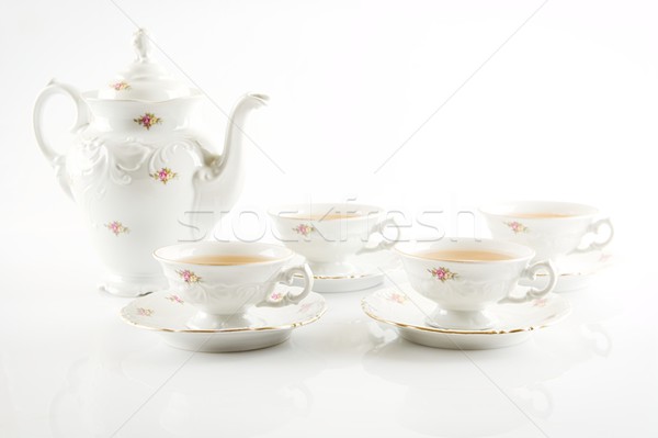 Vintage party kettle with four cups of tea Stock photo © dla4