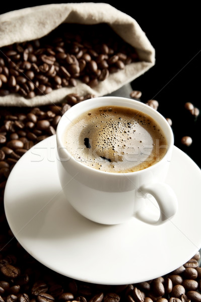 Macro coffee with foam and sack at breakfast on black background Stock photo © dla4