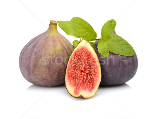 Three sliced figs with mint isolated on white background  Stock photo © dla4